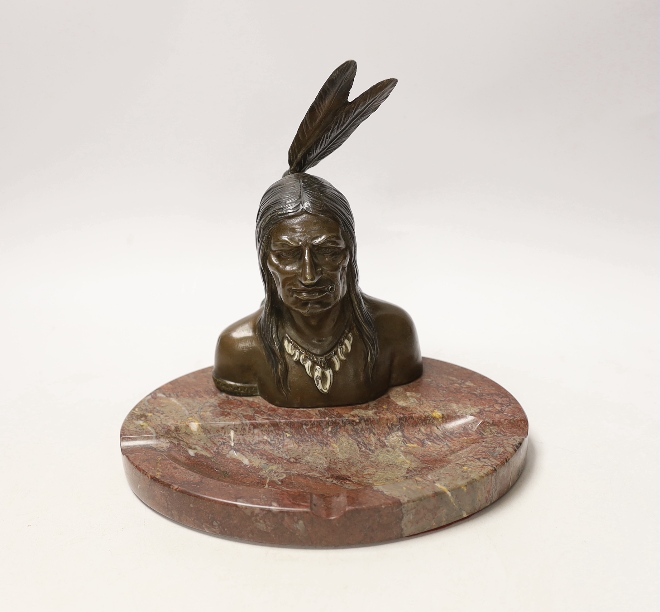An ashtray in the form of a bronze native American, on marble base, 21cm wide